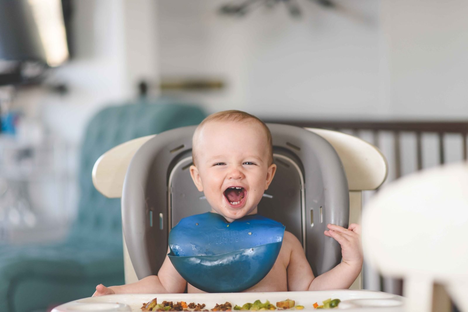 A happy baby enjoying the food
